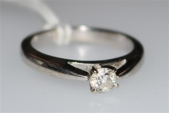 A 14ct white gold and solitaire diamond ring, size K.